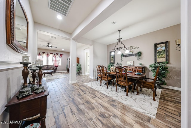20421 W Legend Trl, Buckeye, AZ 85396 - dining room with wood finished floors, baseboards, a ceiling fan, and recessed lighting