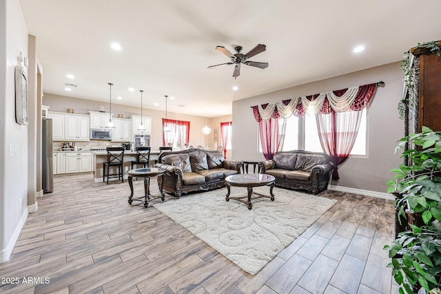 20421 W Legend Trl, Buckeye, AZ 85396 - living area with a ceiling fan, light wood-type flooring, baseboards, and recessed lighting