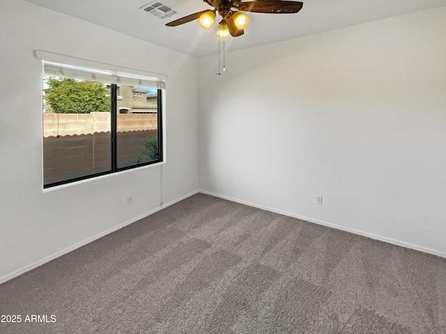 carpeted empty room featuring ceiling fan