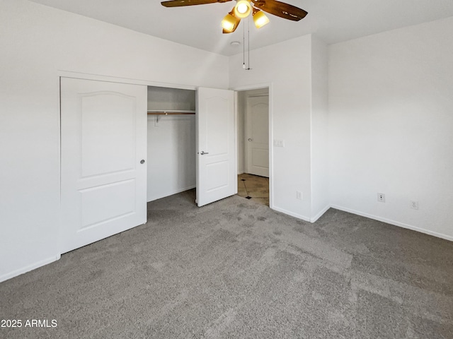 unfurnished bedroom with ceiling fan, a closet, and carpet floors