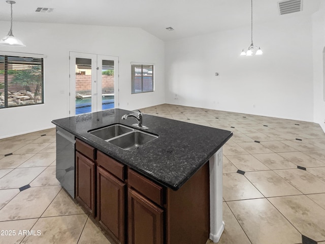 kitchen with sink, hanging light fixtures, stainless steel dishwasher, and light tile patterned flooring