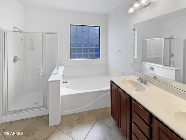 bathroom featuring vanity, tile patterned flooring, and plus walk in shower