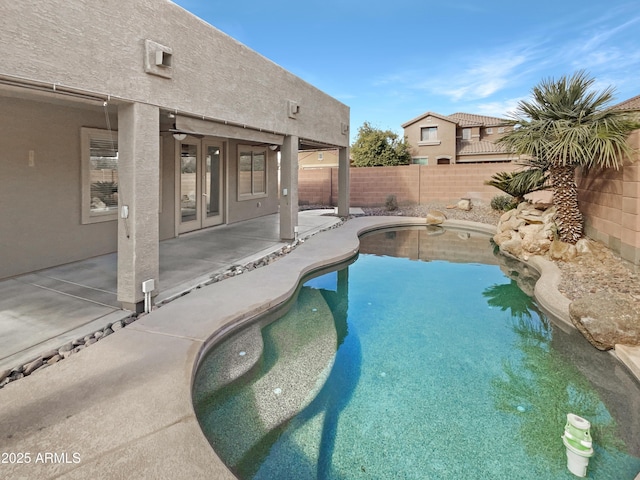 view of swimming pool with a patio area