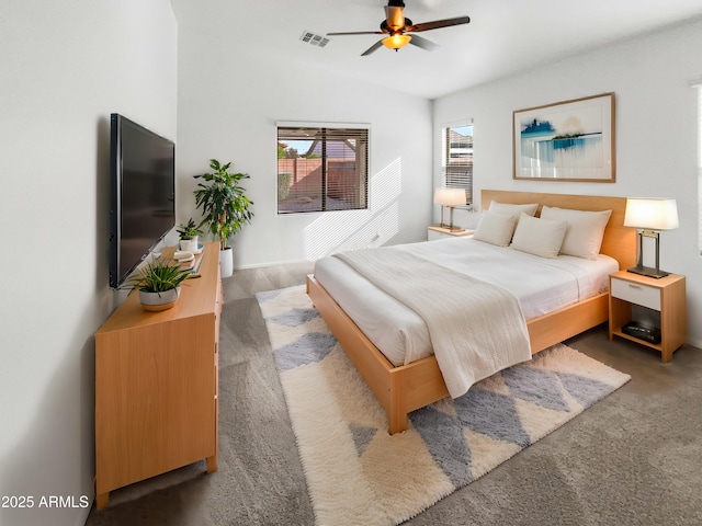 carpeted bedroom with ceiling fan and lofted ceiling