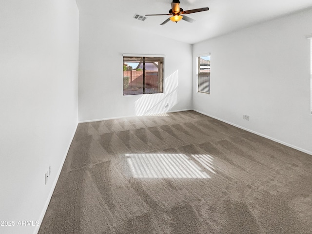 spare room with carpet floors, lofted ceiling, and ceiling fan