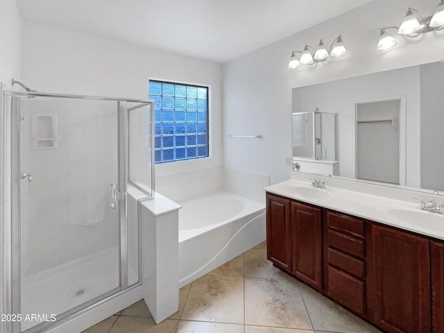 bathroom with tile patterned floors, vanity, and independent shower and bath