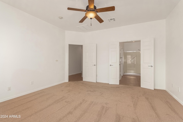 unfurnished bedroom with carpet floors and ceiling fan