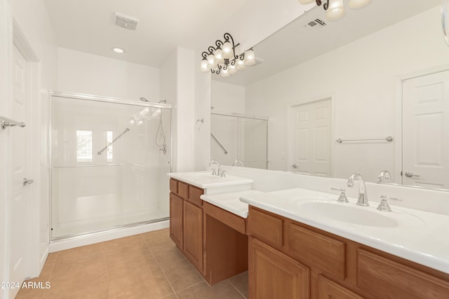 bathroom featuring tile patterned floors, vanity, and walk in shower