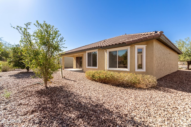 back of property featuring a patio area