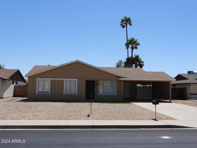 ranch-style home with a carport