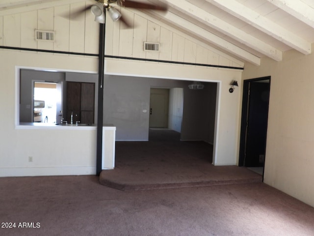 carpeted empty room featuring ceiling fan, beamed ceiling, and high vaulted ceiling