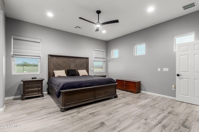 bedroom with ceiling fan and light hardwood / wood-style floors