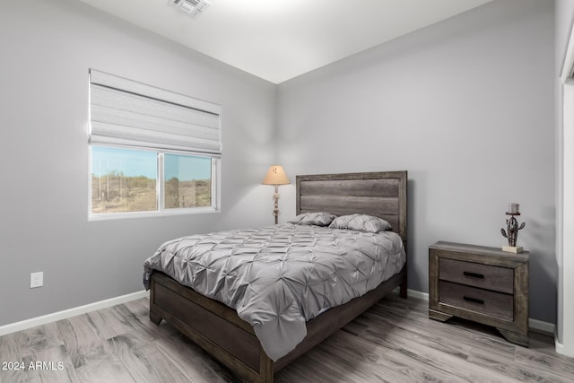 bedroom with light hardwood / wood-style floors