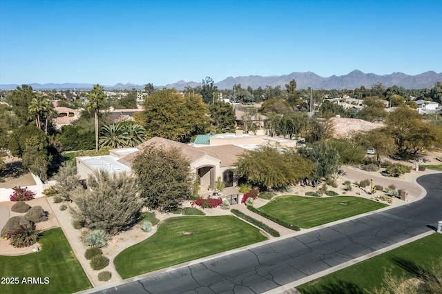 birds eye view of property with a mountain view