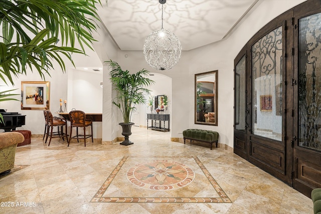 foyer with a chandelier