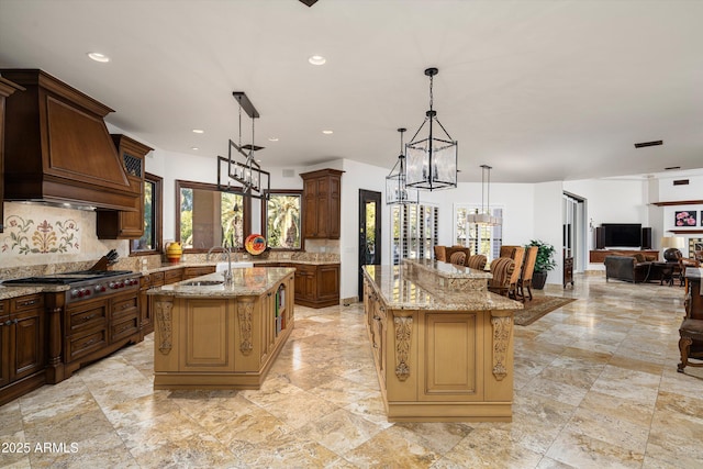 kitchen with decorative light fixtures, decorative backsplash, and a spacious island