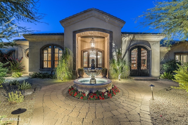 view of exterior entry with french doors