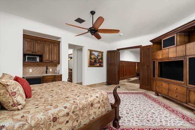 bedroom with wine cooler, crown molding, and ceiling fan