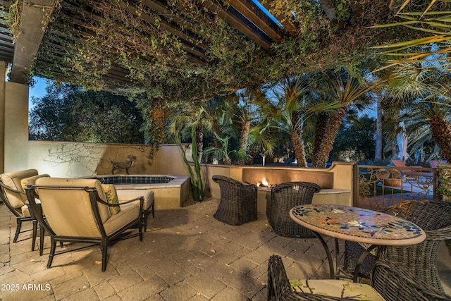 view of patio with a fire pit