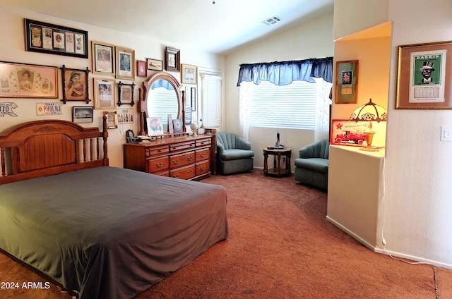 carpeted bedroom with vaulted ceiling