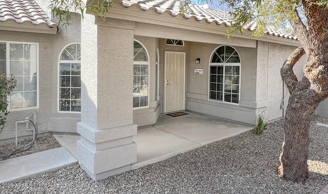 entrance to property featuring a patio