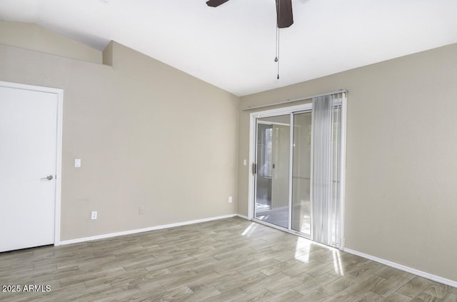 spare room with lofted ceiling, light hardwood / wood-style floors, and ceiling fan