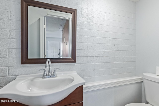 bathroom with toilet and vanity