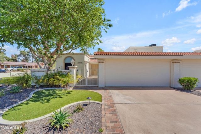 11465 N 56th St, Scottsdale, AZ 85254 - mediterranean / spanish-style house featuring a tiled roof, a fenced front yard, an attached garage, concrete driveway, and stucco siding