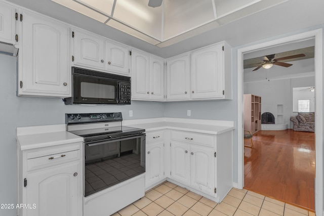 11465 N 56th St, Scottsdale, AZ 85254 - kitchen with black appliances, a ceiling fan, light countertops, and white cabinets