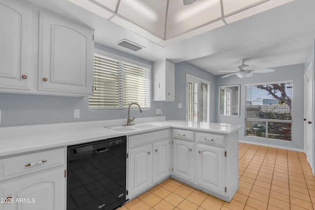 11465 N 56th St, Scottsdale, AZ 85254 - kitchen with dishwasher, a sink, a peninsula, light tile patterned floors, and white cabinets