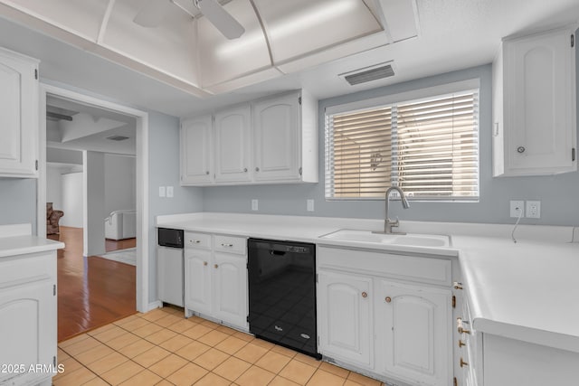 11465 N 56th St, Scottsdale, AZ 85254 - kitchen with black dishwasher, a sink, white cabinetry, a ceiling fan, and light countertops