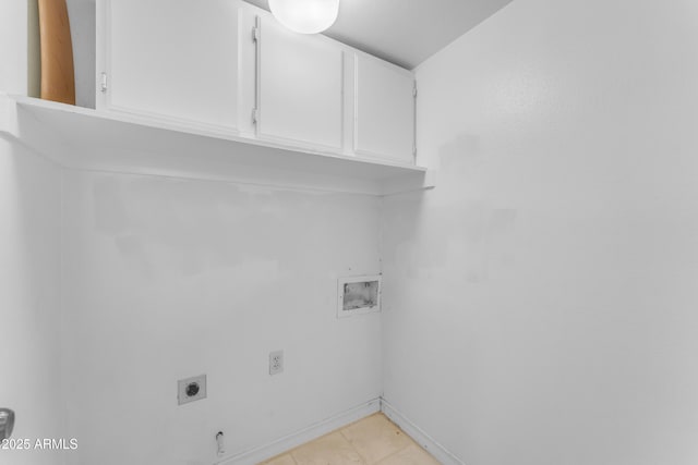 11465 N 56th St, Scottsdale, AZ 85254 - laundry area with cabinet space, electric dryer hookup, washer hookup, baseboards, and light tile patterned floors