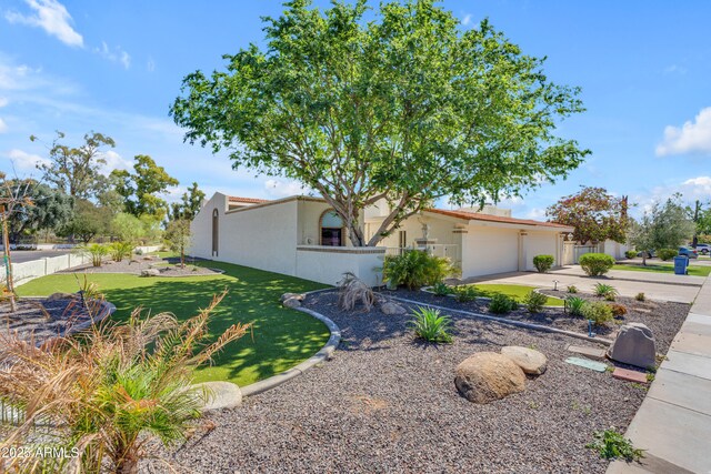 11465 N 56th St, Scottsdale, AZ 85254 - view of front of property featuring stucco siding, concrete driveway, an attached garage, and fence