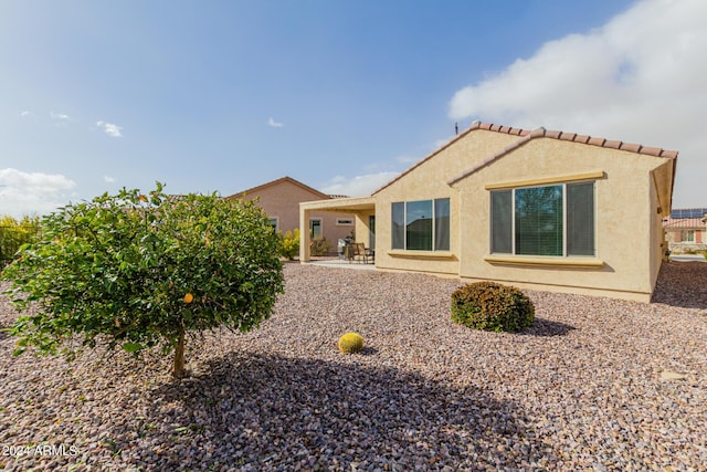 view of side of home featuring a patio