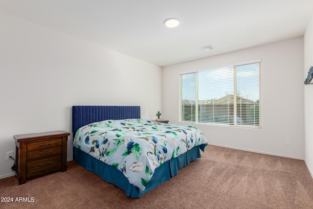 bedroom with light colored carpet