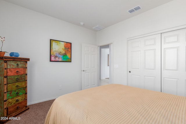 carpeted bedroom featuring a closet