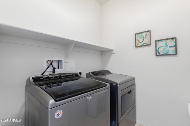 washroom with separate washer and dryer