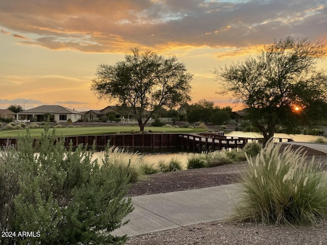 view of home's community with a water view