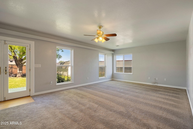 864 S 1st St, Snowflake, AZ 85937 - carpeted empty room featuring plenty of natural light, ceiling fan, and baseboards