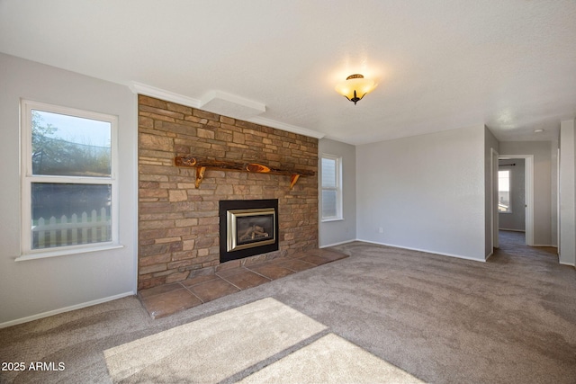 864 S 1st St, Snowflake, AZ 85937 - unfurnished living room with healthy amount of natural light, a stone fireplace, and carpet floors