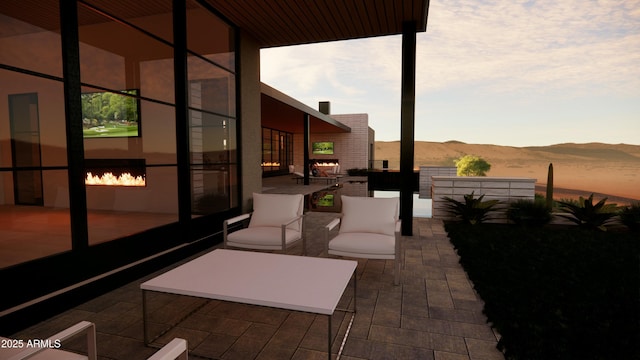 patio terrace at dusk with a mountain view