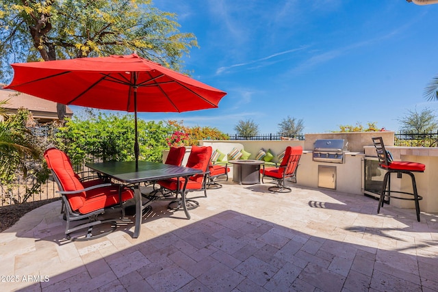 view of patio / terrace featuring area for grilling and an outdoor kitchen