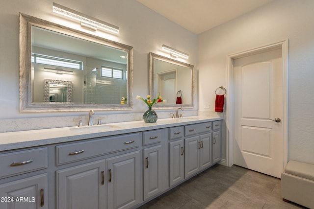 bathroom featuring vanity and an enclosed shower