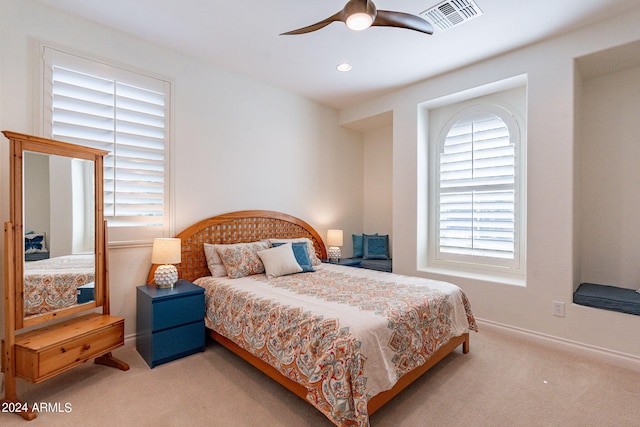 bedroom with light colored carpet and ceiling fan