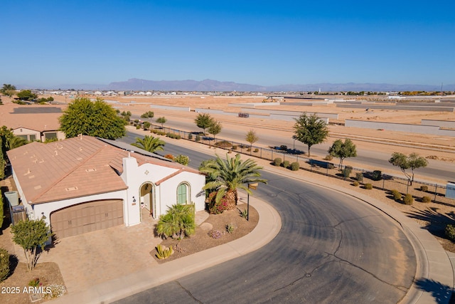 birds eye view of property featuring a mountain view