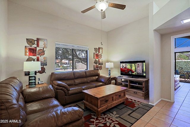 tiled living room featuring ceiling fan