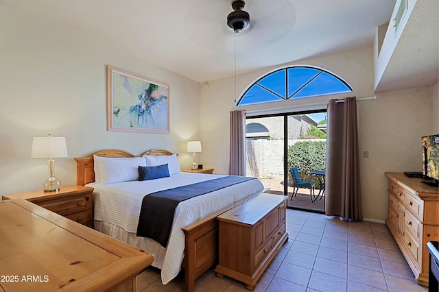 tiled bedroom with ceiling fan and access to exterior