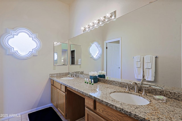 bathroom with tile patterned floors and vanity