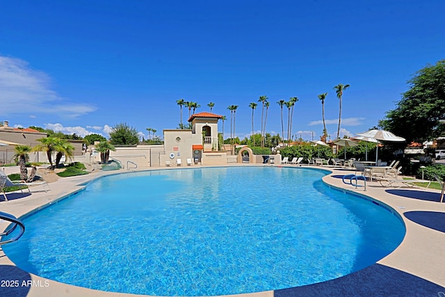 view of swimming pool featuring a patio