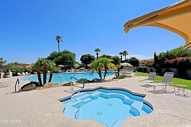 view of swimming pool featuring a patio area